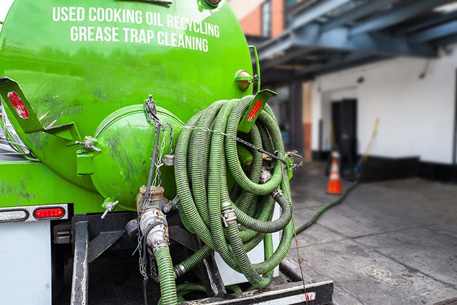 a pump truck emptying a grease trap in Arrington, TN